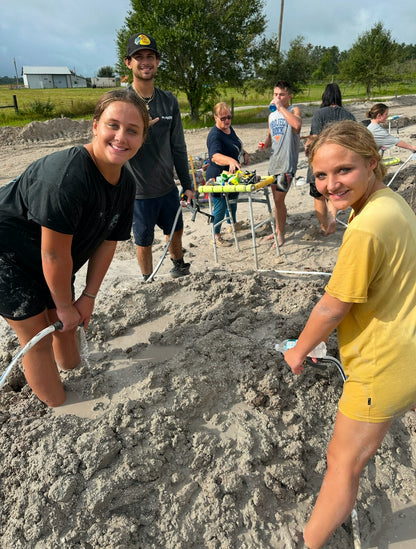 getting messy in the sand with the family